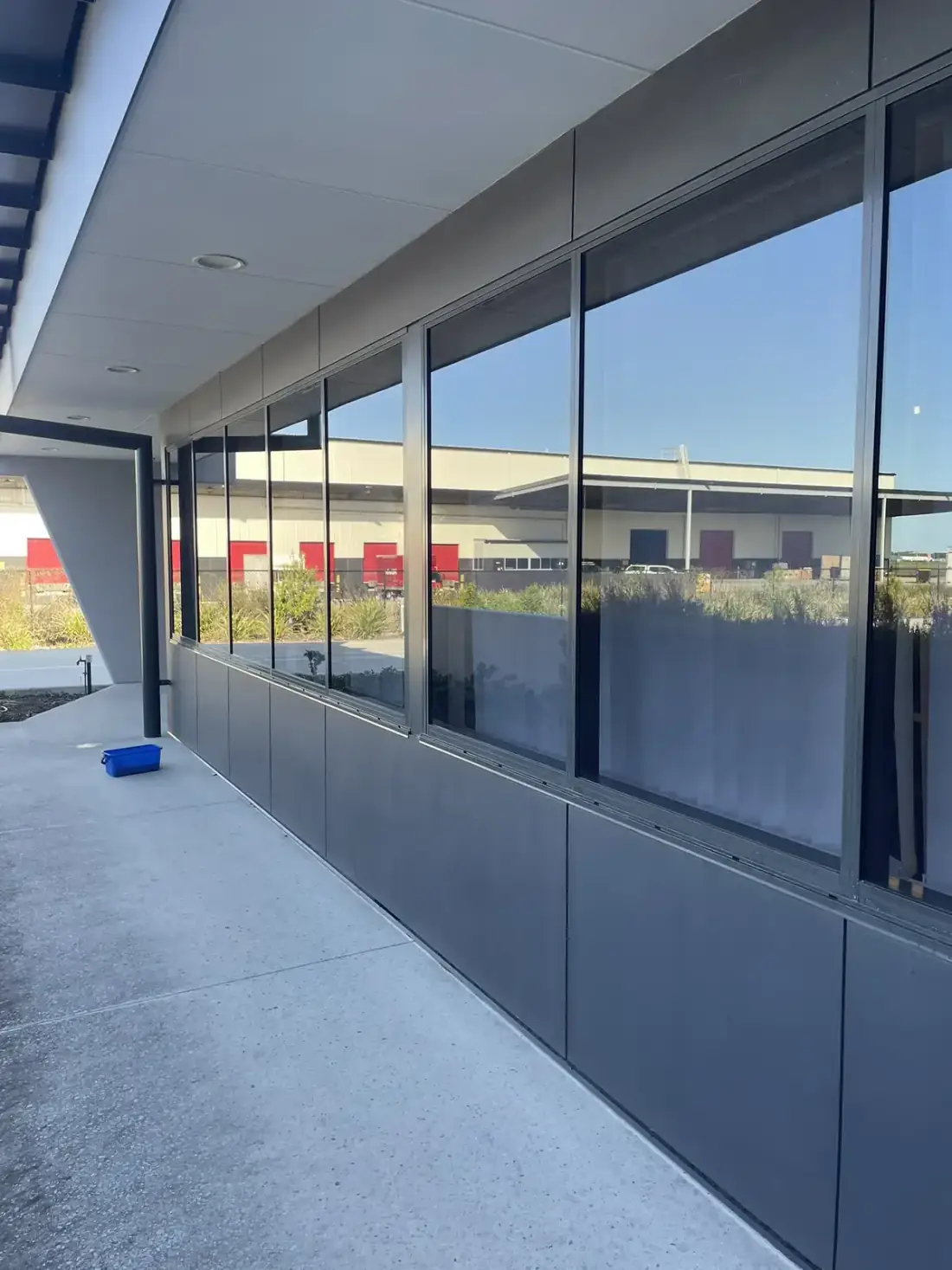 Long run of streak free commercial glazing along a covered walkway