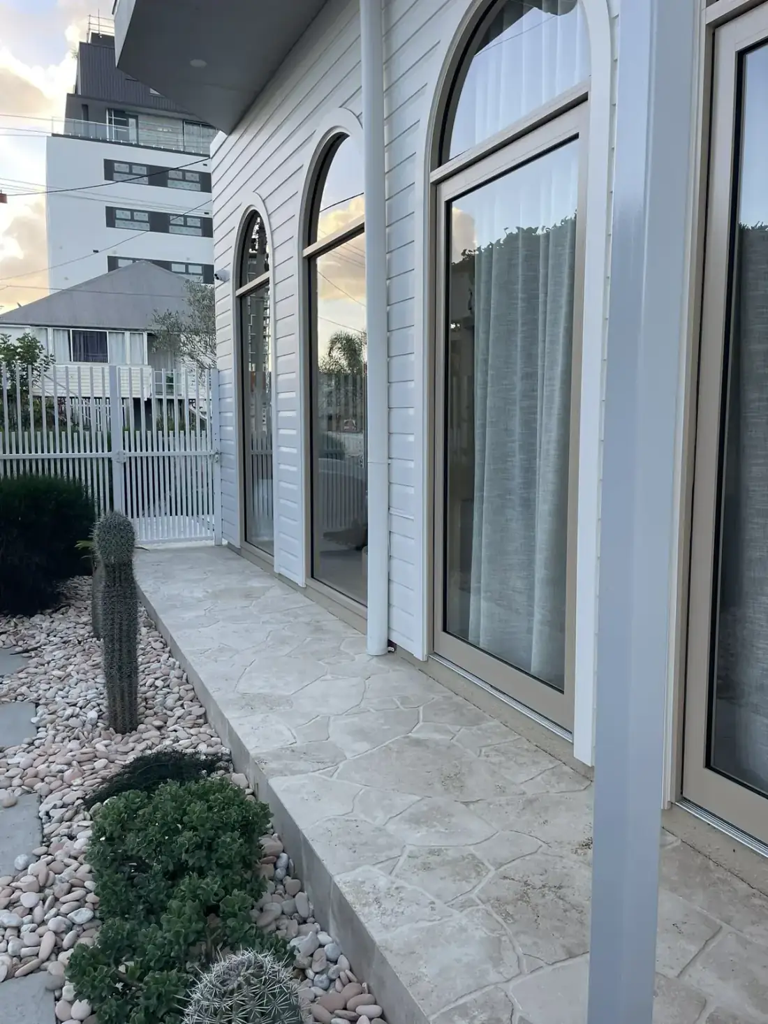 Brisbane home exterior with sparkling sash windows above the front porch